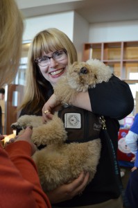 Nancy Webb from CSN office of eLearning sharing a hug with Benny the Love Dog.
