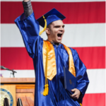 A CSN graduate from the class of 2015 celebrates receiving his diploma.
